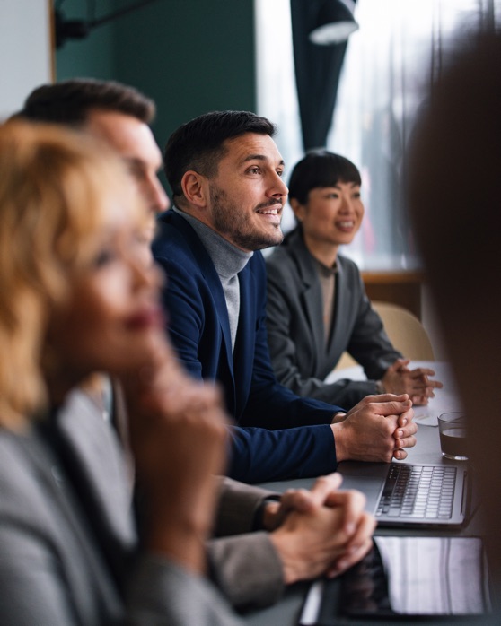 Narrow focus on confident man in meeting
